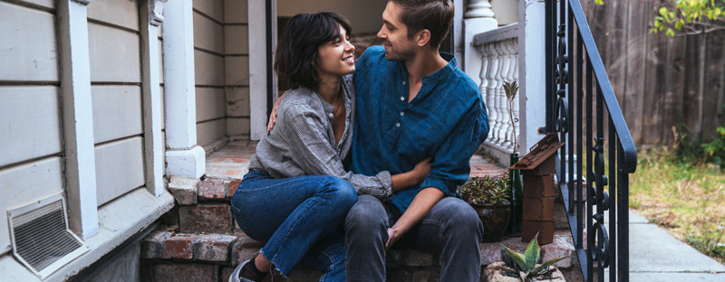 Couple reviewing pre-approval documents for home purchase